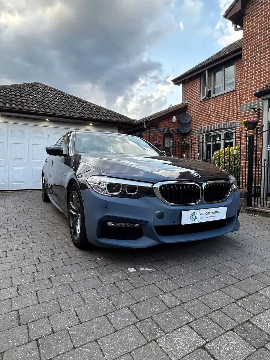 Scuffed BMW bumper damage before end of lease repair