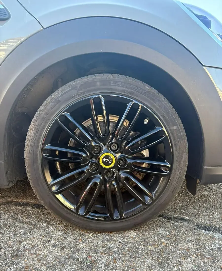 Mini Cooper alloy wheel refinished in gloss black after refurbishment
