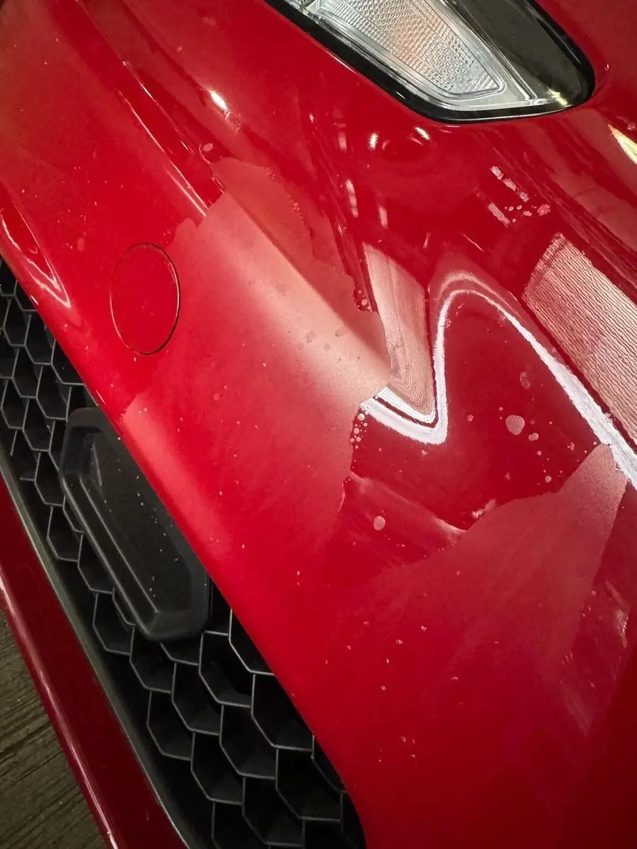 Deep scratch through the paintwork on an Alfa Romeo Giulia panel before repair