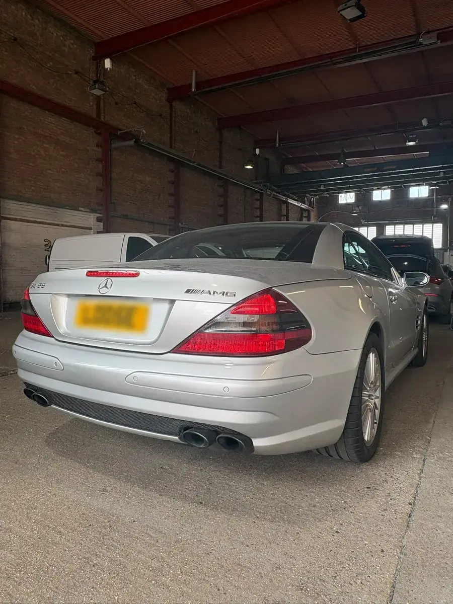 Silver Mercedes SL55 AMG with its rear bumper repaired and refinished
