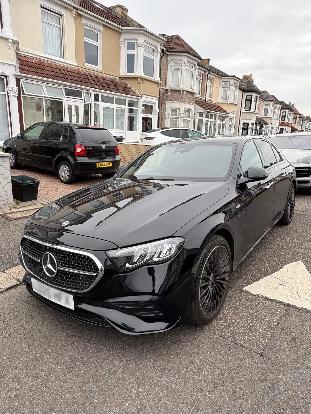 The same black Mercedes E-Class front bumper repaired, repainted and polished to a gloss finish